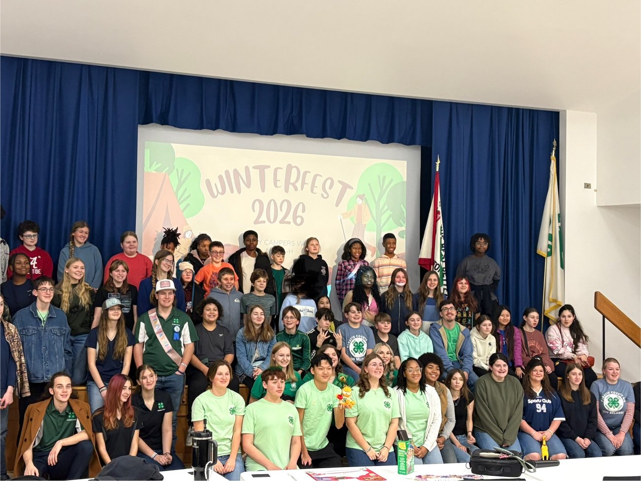 Photo from NC Cooperative Extension Guilford County Center Open House. People conversing and visiting information tables in the lobby. 