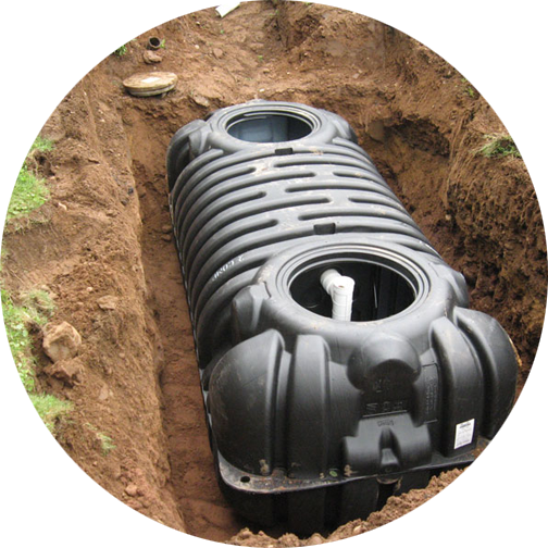 A septic tank in an open trench, waiting for the trench to
be filled in.