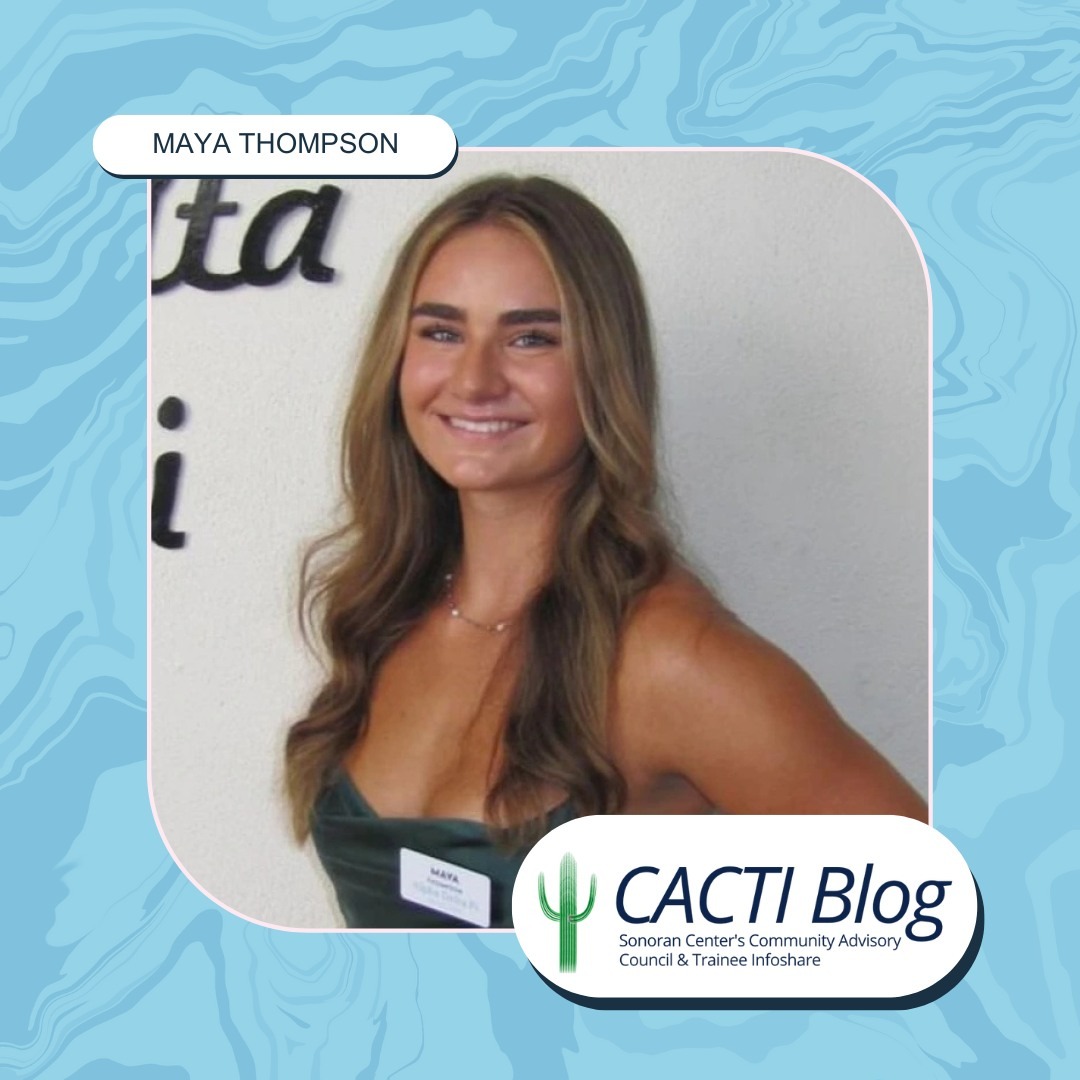 Maya Thompson, a young person with long blond hair and a gray top, smiling in front of a white background"