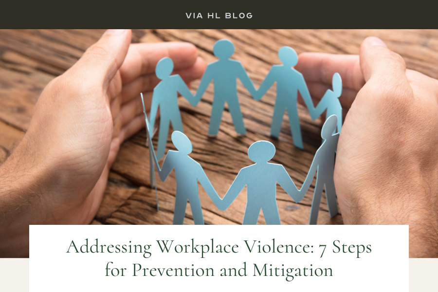Via HL Blog image: Two hands surround paper people, protecting people concept Addressing Workplace Violence: 7 Steps for Prevention and Mitigation 