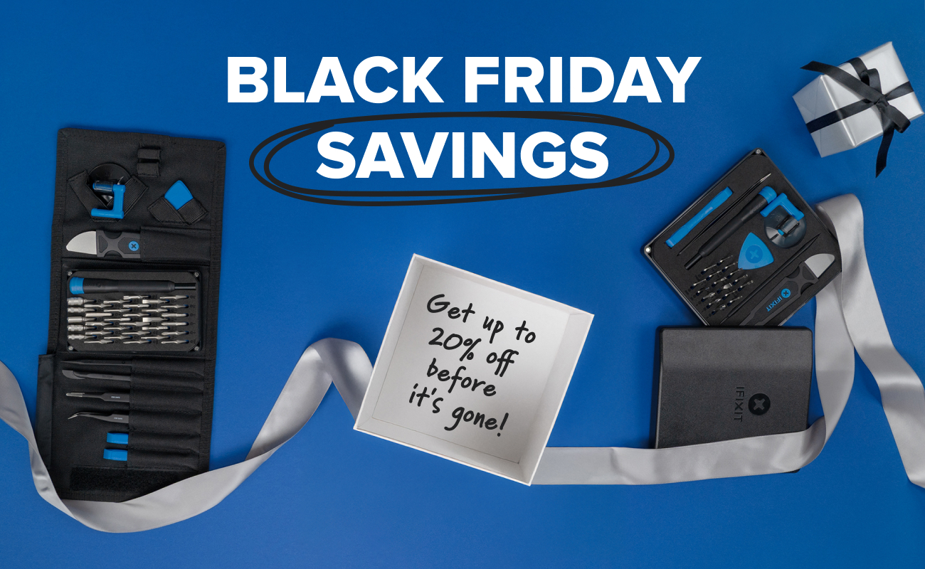 A flat lay on a bright blue background featuring the iFixit Pro Tech Go and Electronic Essential Toolkit arranged with wrapped gifts and a flowing silver ribbon. At the center, an open white box displays the handwritten message “Get up to 20% off before it’s gone!” while bold text above reads “BLACK FRIDAY SAVINGS,” with “SAVINGS” circled for emphasis.