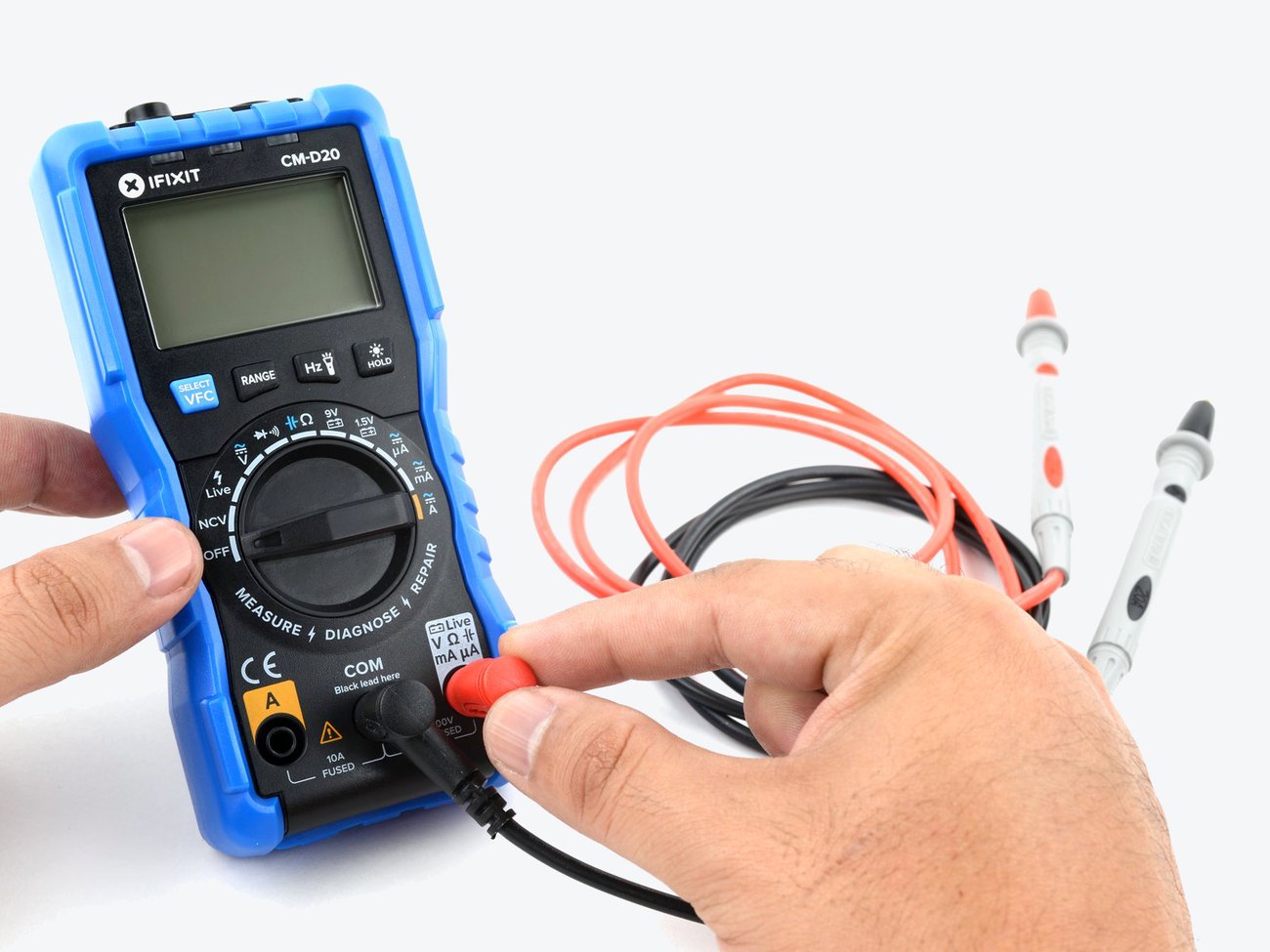 The iFixit Digital Multimeter with red and black probes for measuring voltage