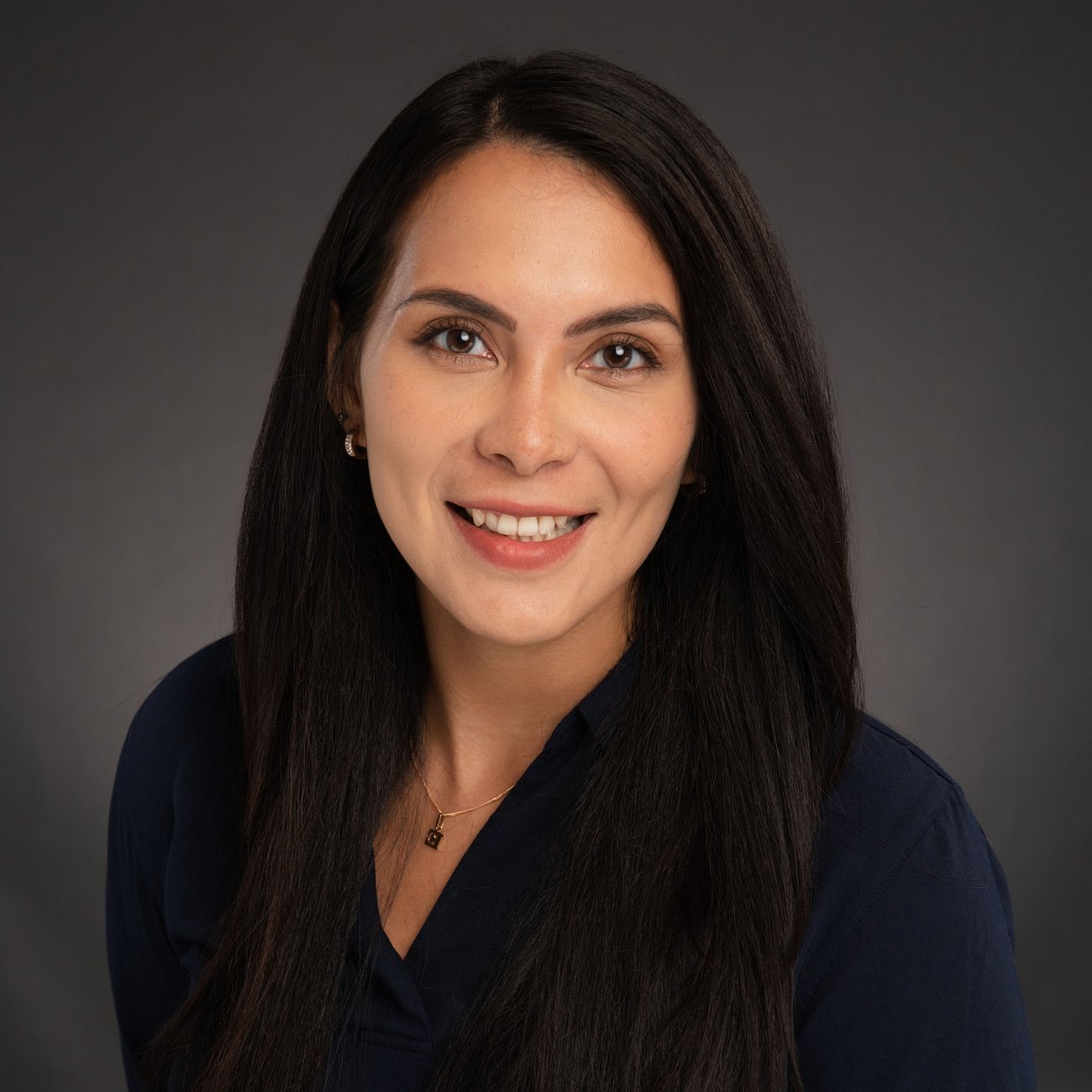 Image of a women wearing black top smiling