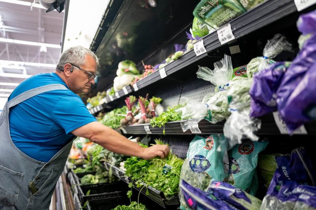 A customer shops for cilantro at a Walmart Supercenter.