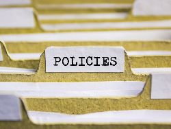 File folder with the word policies on it File folder with the word policies on it