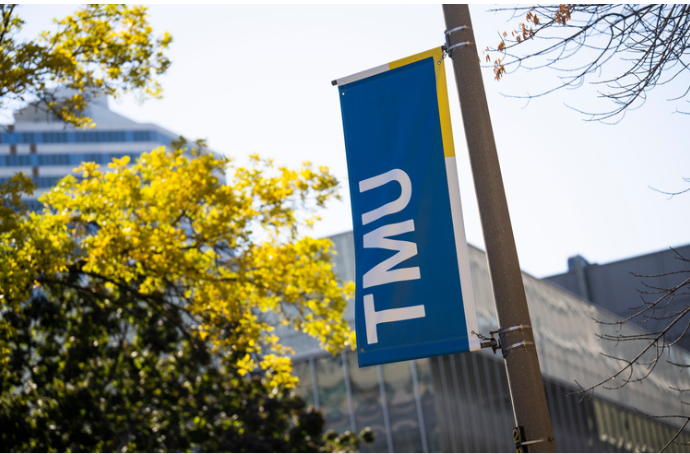TMU banner. Outside. TMU banner. Outside.