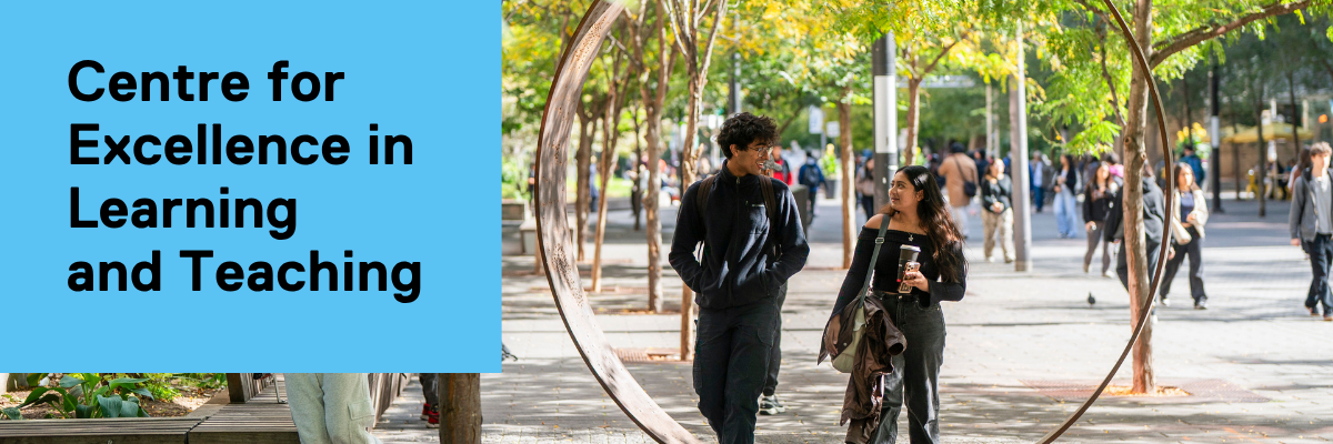Two people walking down Gould Street behind The Ring. 