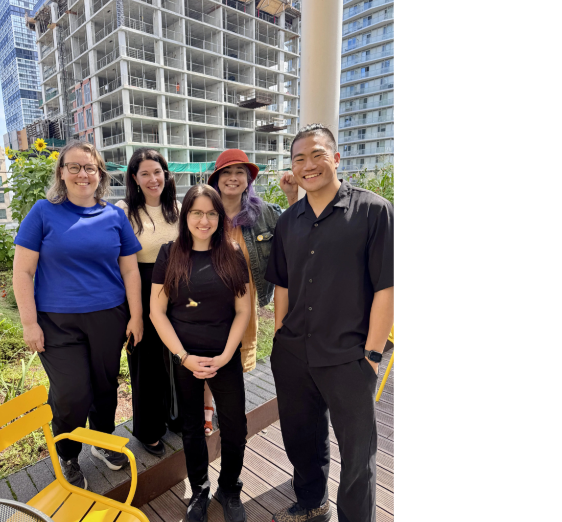The Teaching Fellows smiling at the camera on the DCC rooftop.