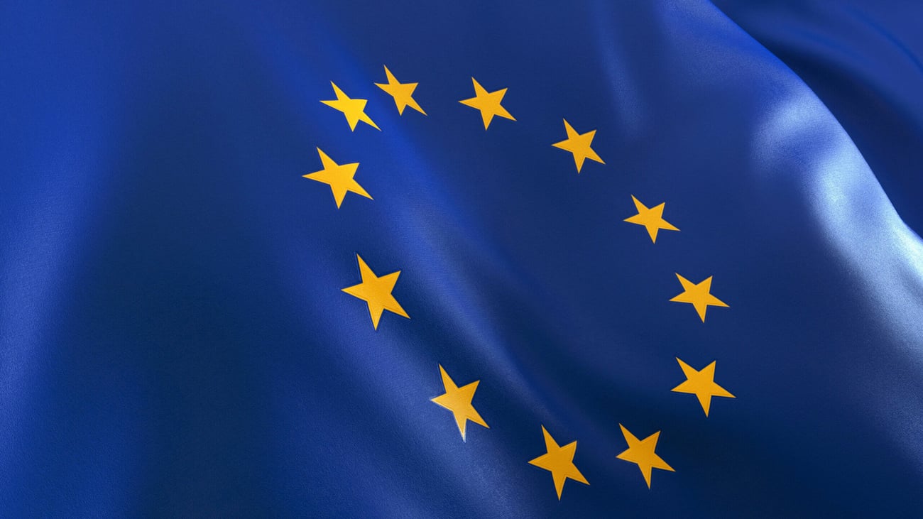 A blue European Union flag with a circle of yellow stars