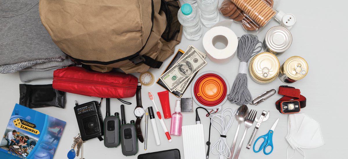 overhead shot of scattered items from a disaster supply kit overhead shot of scattered items from a disaster supply kit