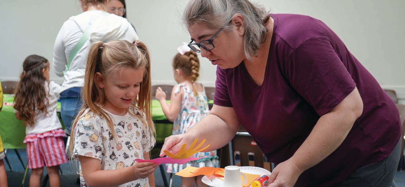 librarian help kid with craft librarian help kid with craft