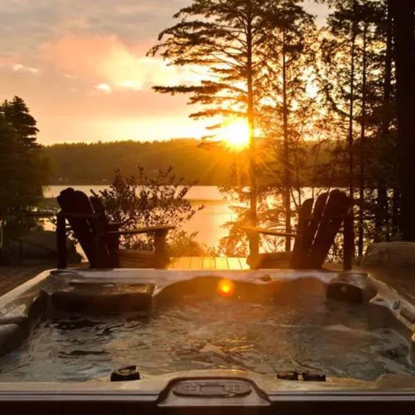 hot tub by lake at sunset