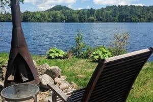 chair and fire pit by water