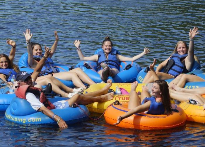 group of people lazy river tubing