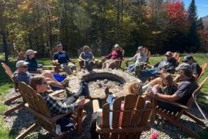 group gathered around fire pit group gathered around fire pit