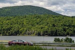 car driving on road in adirondacks