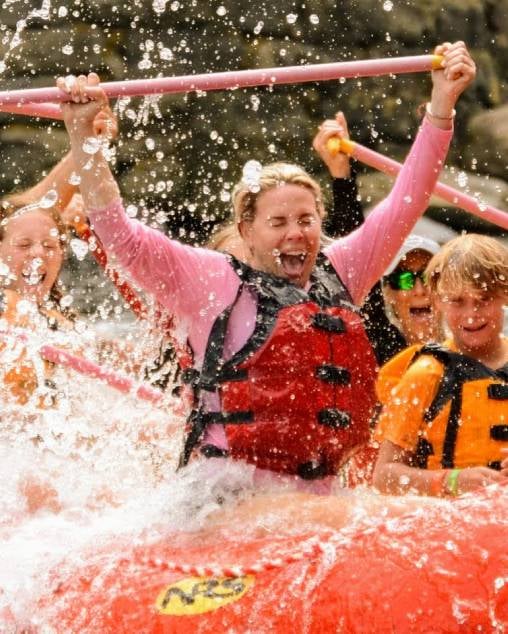 woman screaming in happiness whitewater rafting