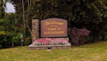 welcome to the town of queensbury sign