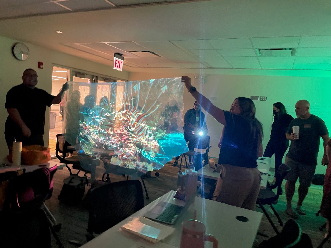 Adults exploring light and shadow 