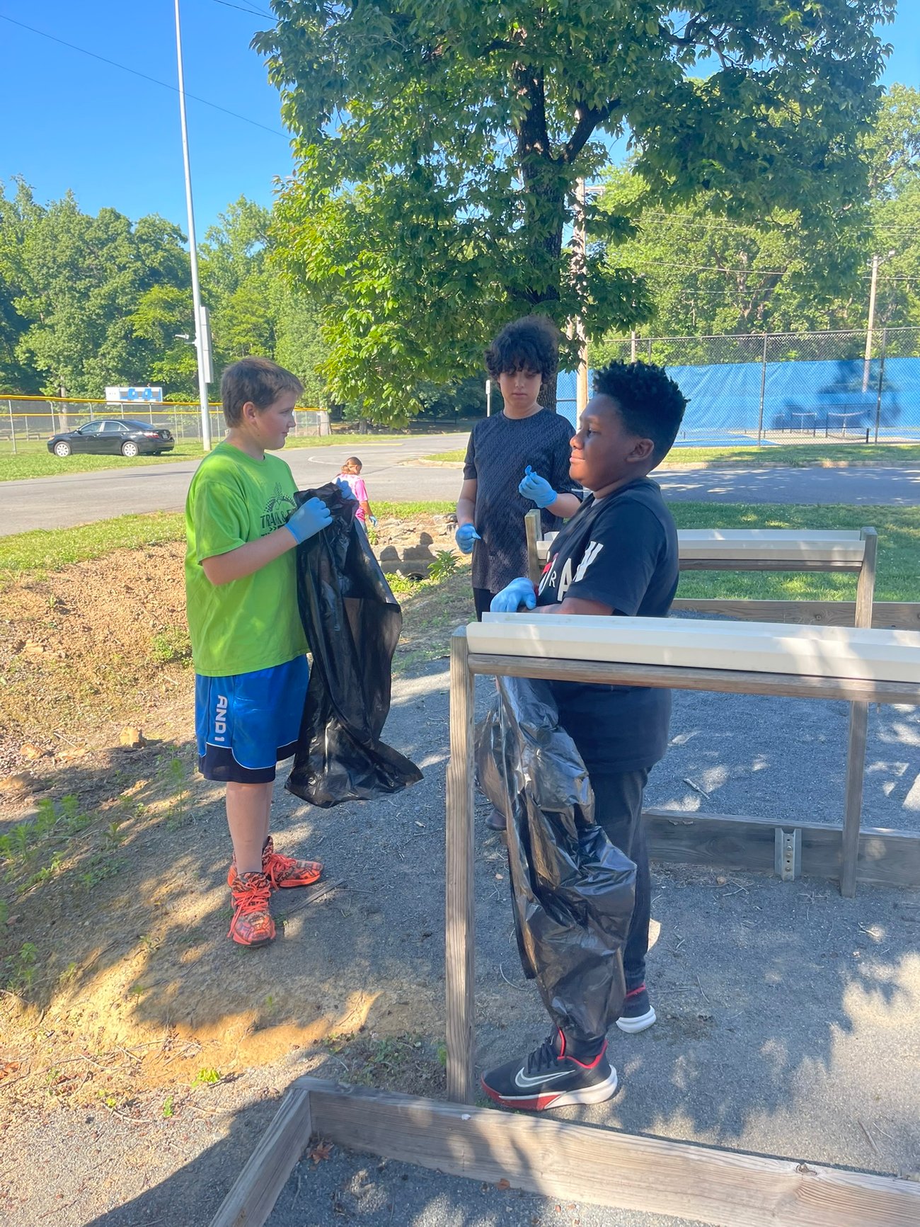 Kids bagging trash