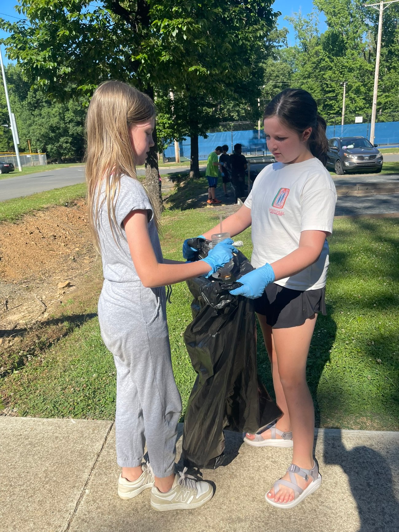 Kids Bagging Trash