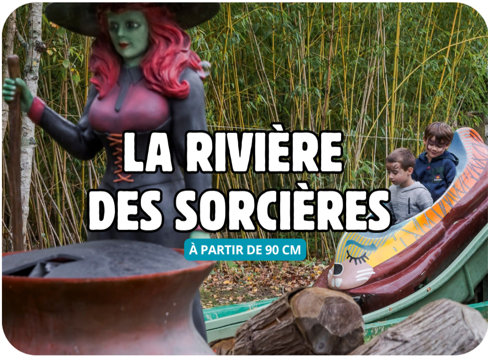 A witch figure and two children beside a colorful water slide