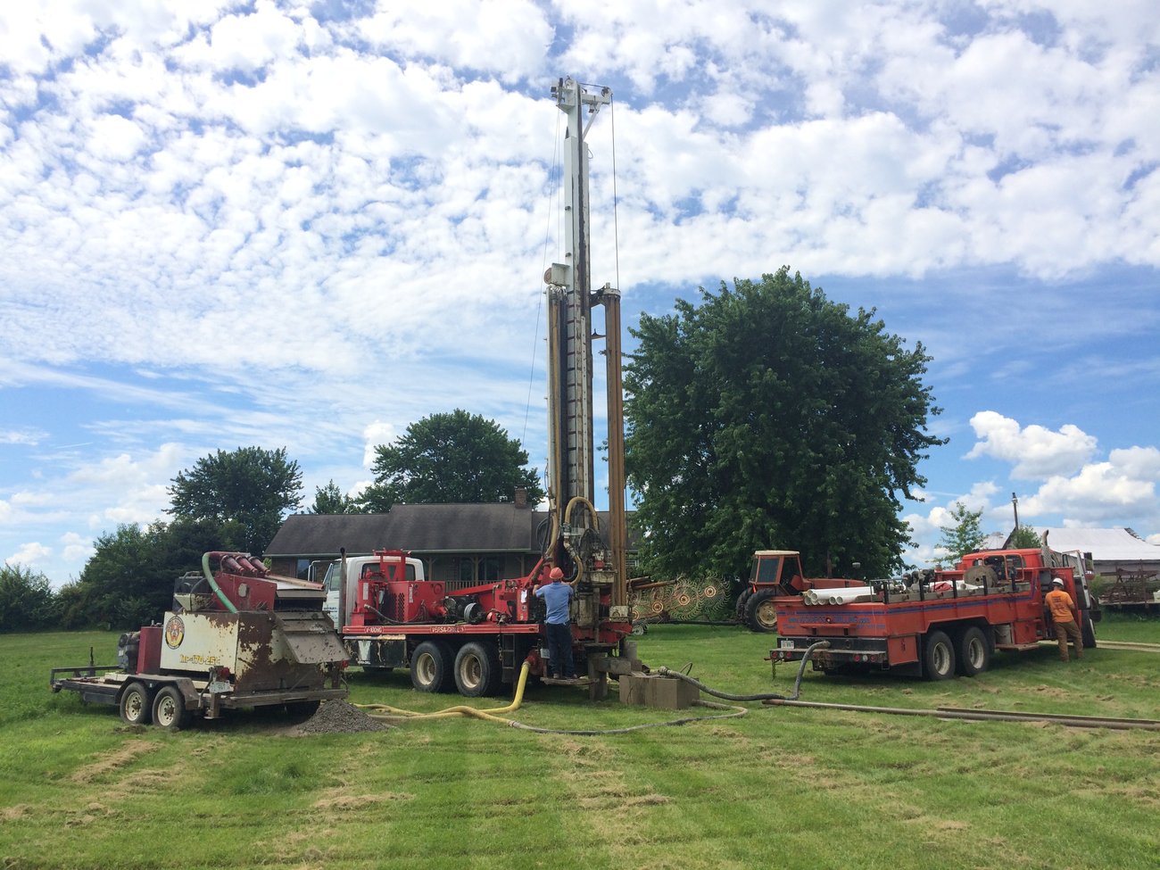 A well driller preparing their well rig in order to drill a new water well.