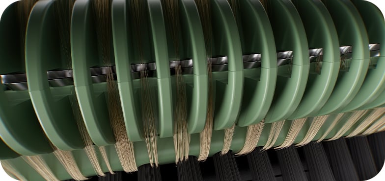 Close-up of green curved forms over woven beige and black strands