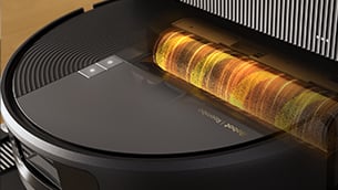 A black robot vacuum with a glowing cylindrical brush on top
