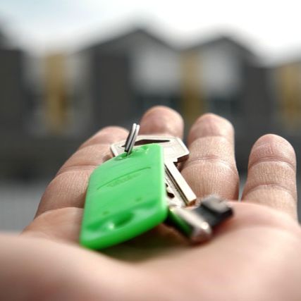 Hand holding a set of house keys