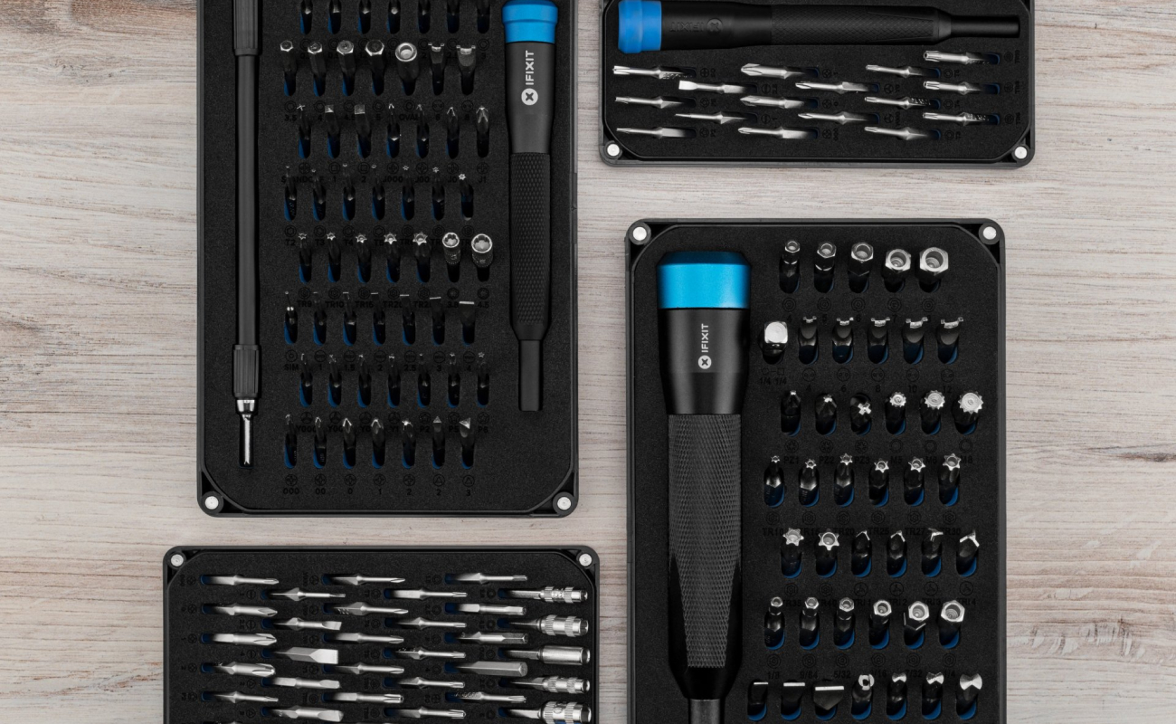 A top-down product image of Mako, Mahi, Minnow and Moray Driver Kits on a light wooden surface. The layout creates a structured comparison of different drivers and bit selections.