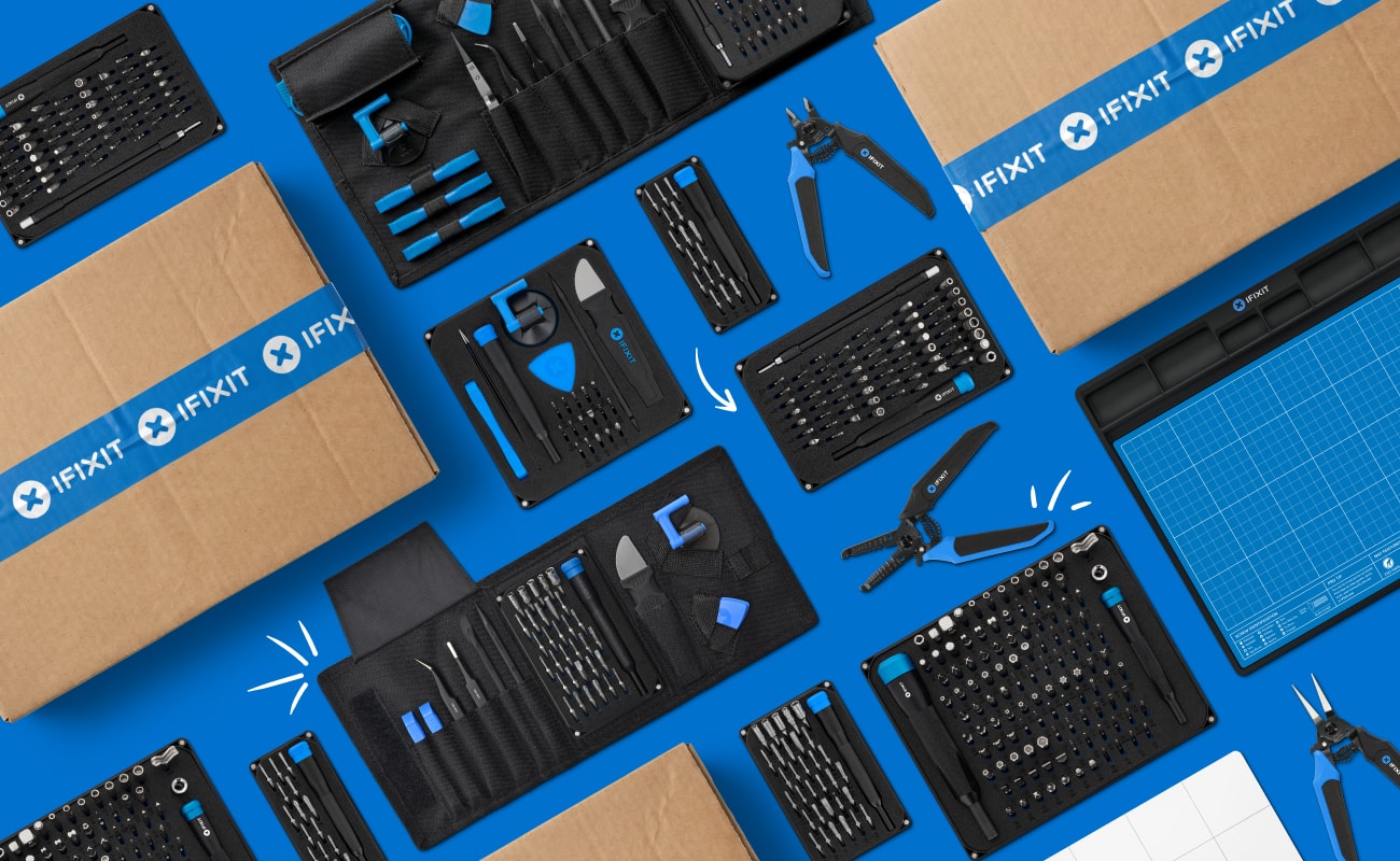 Top-down layout of iFixit toolkits, pliers, bit sets, project mats, and shipping boxes
neatly arranged on a blue background with small hand-drawn, white accent marks. 