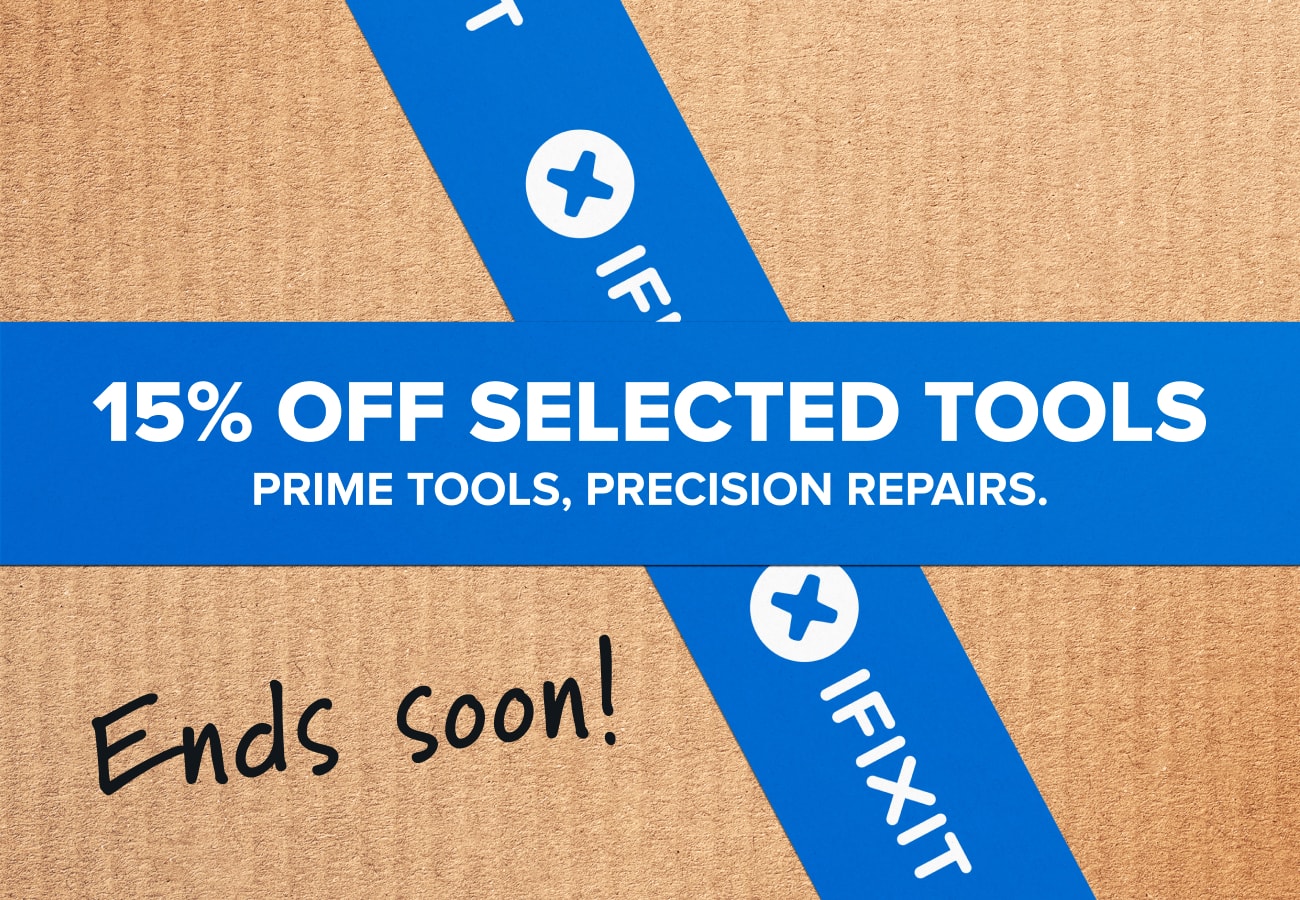 Cardboard-textured background with blue iFixit tape forming a cross behind a bold blue banner that reads “15% off selected tools” and “Prime tools, precision repairs.” A handwritten “Ends soon!” message appears in the lower-left corner.