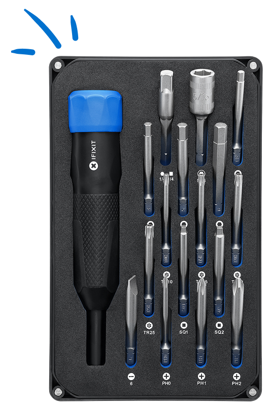 iFixit Megalodon driver and 16 extended-reach bits are neatly
arranged in a black foam tray, with bit labels printed below each slot. Blue hand-drawn accent marks in the top-left corner highlight the compact kit layout.