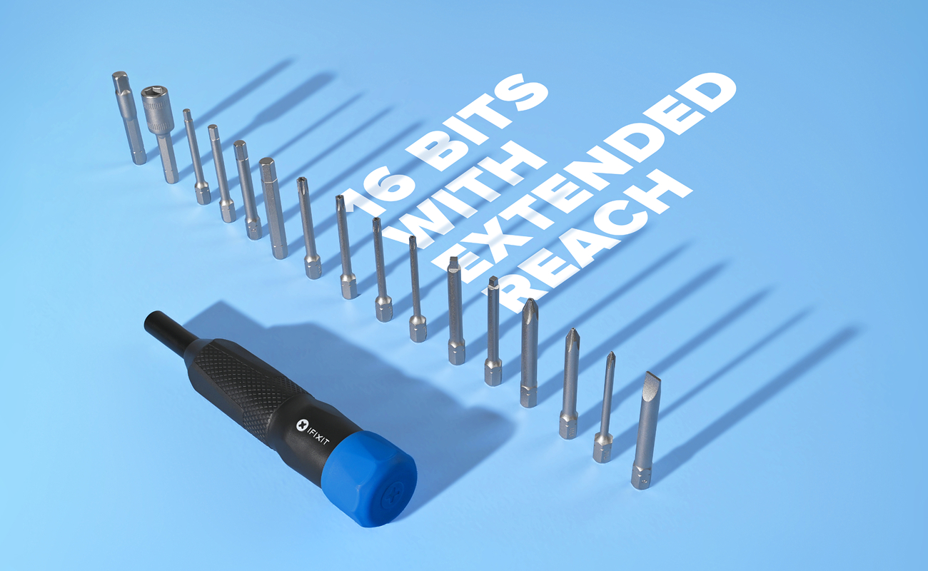 iFixit Megalodon driver and 16 extended-reach bits arranged in a row on a bright blue background, casting long shadows. Bold white text reads “16 bits with extended reach.”