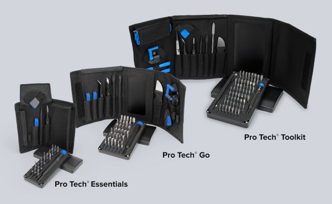 Three open black iFixit Pro Tech toolkits are arranged from smallest to largest against a light gray background, each with a
precision-bit case in front. Labels identify them as Pro Tech Essentials, Pro Tech Go, and Pro Tech Toolkit. Three open black iFixit Pro Tech toolkits are arranged from smallest to largest against a light gray background, each with a precision-bit case in front. Labels identify them as Pro Tech Essentials, Pro Tech Go, and Pro Tech Toolkit.