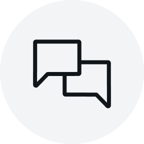 Light grey circular icon showing two overlapping black speech bubbles, centered on a solid background.