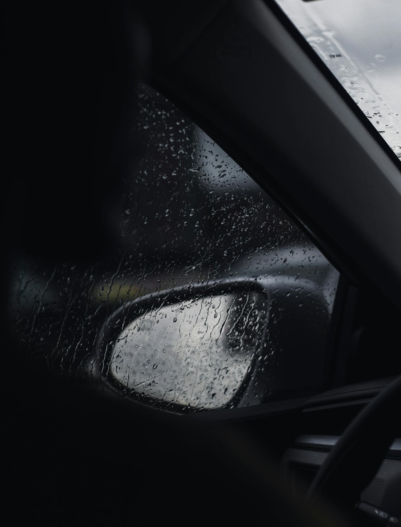 Photo of rain through a car window Photo of rain through a car window