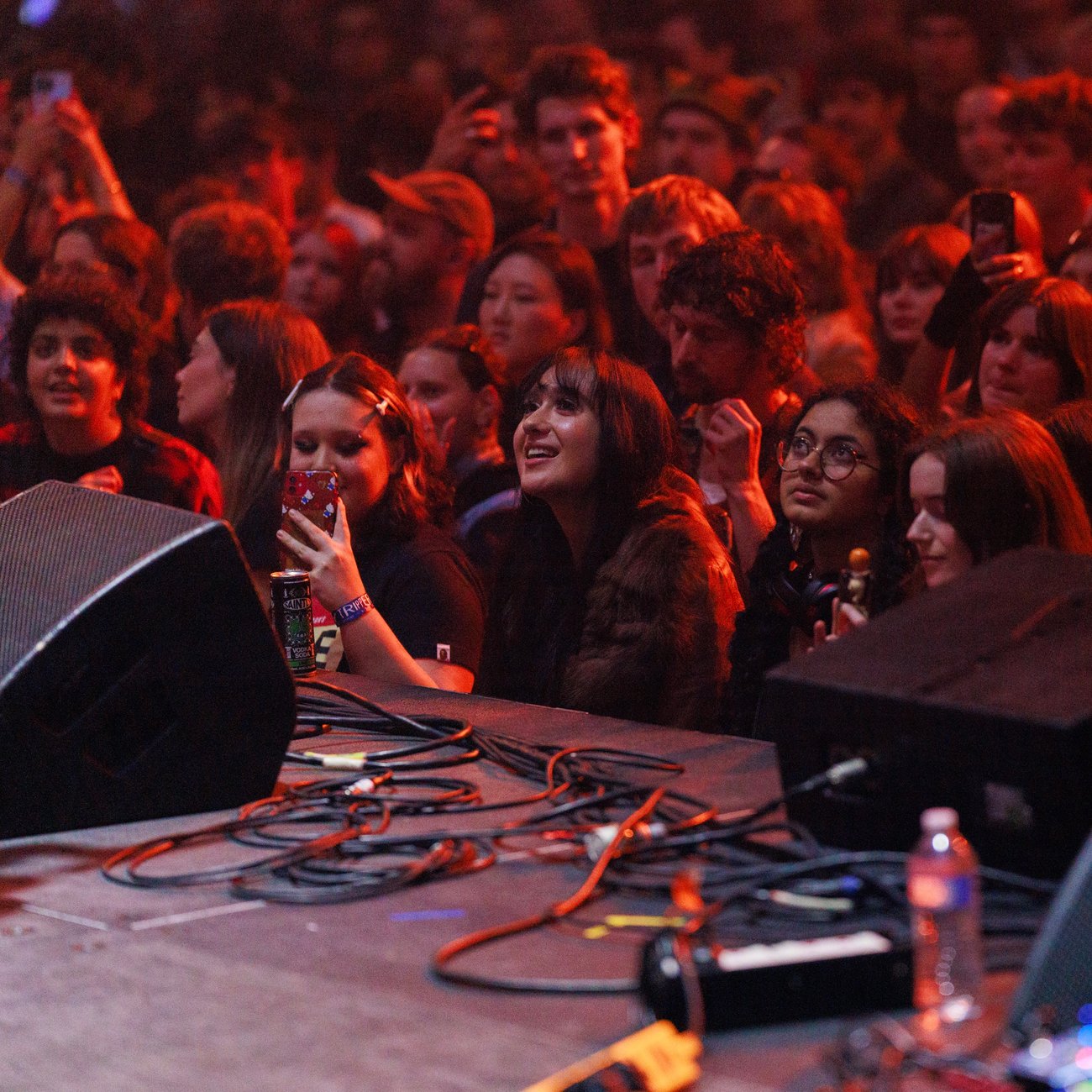An excited crowd at standing front of stage at RISING