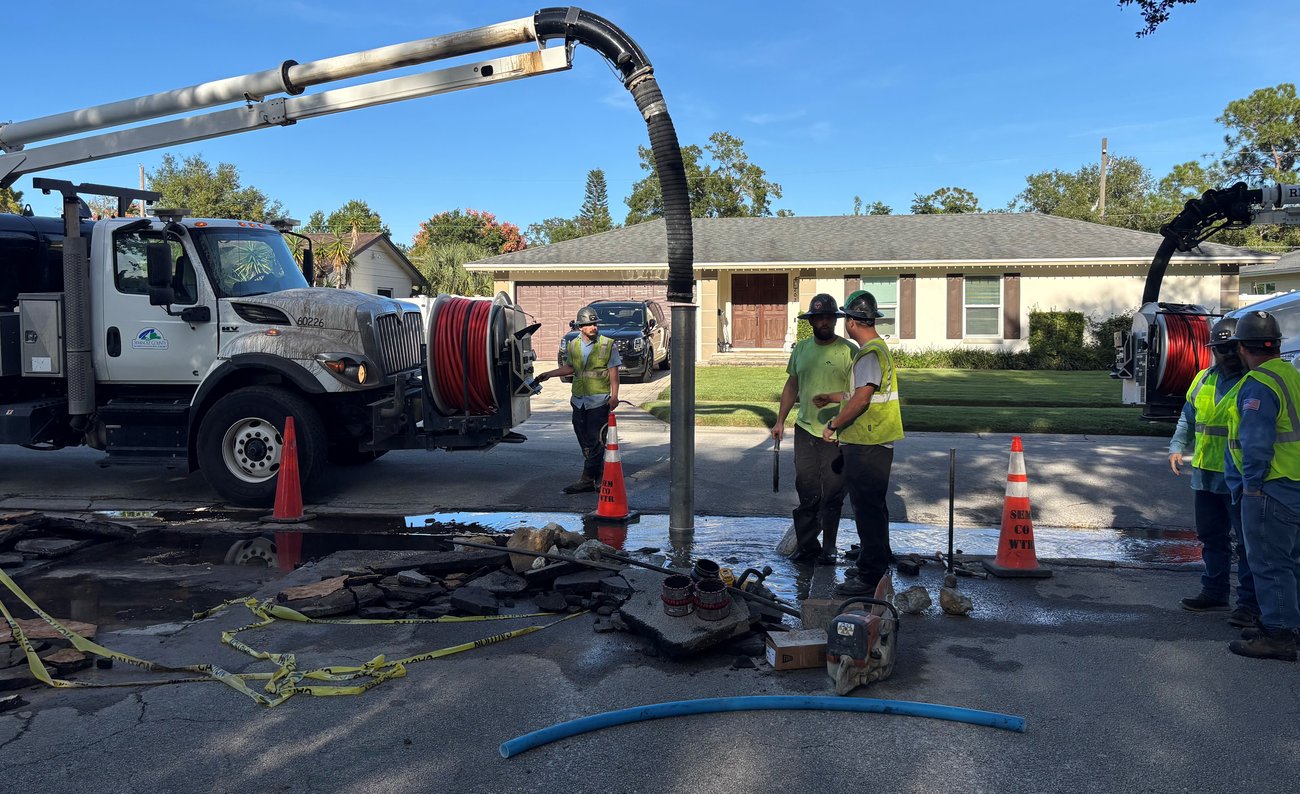 utilities workers using equipment