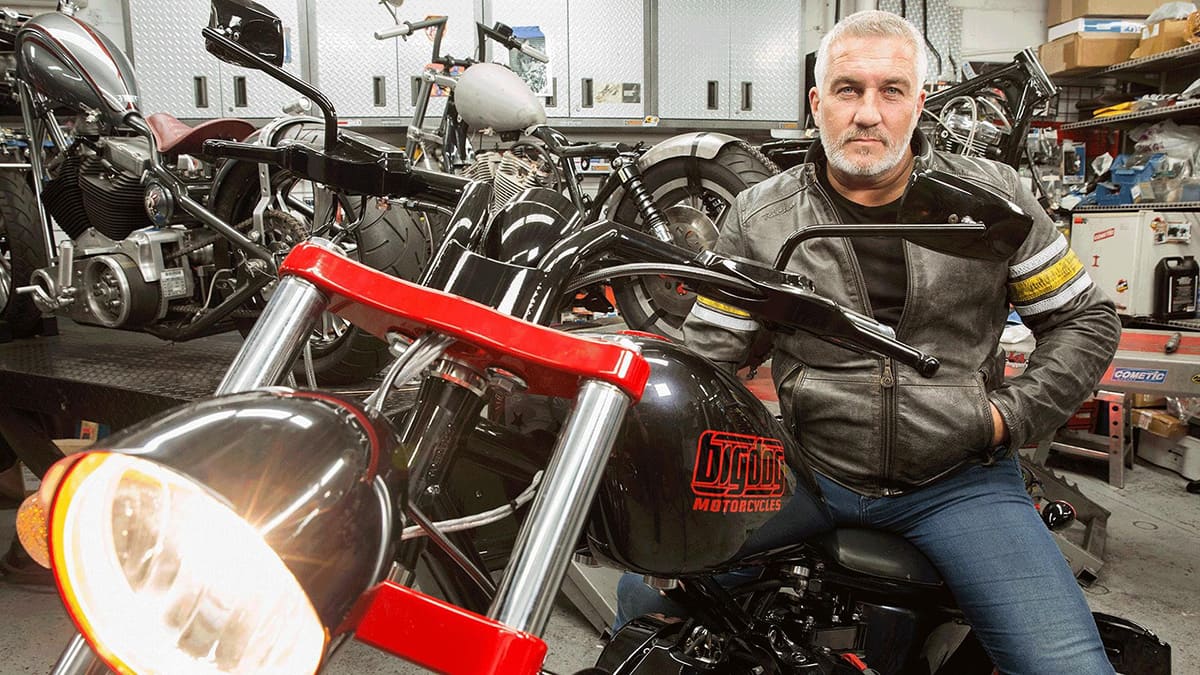 Paul Hollywood in a leather jacket sits on a motorcycle Paul Hollywood in a leather jacket sits on a motorcycle