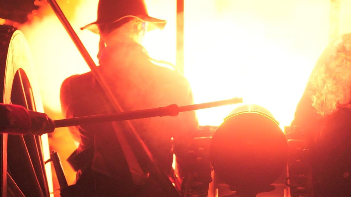 A large orange blast fires out of a cannon that has just been lit A large orange blast fires out of a cannon that has just been lit