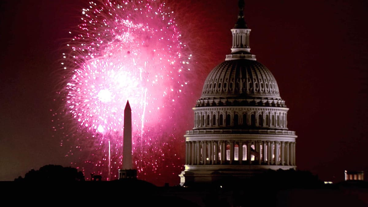 The U.S. Capitol and Washington Monument with fireworks in the background The U.S. Capitol and Washington Monument with fireworks in the background