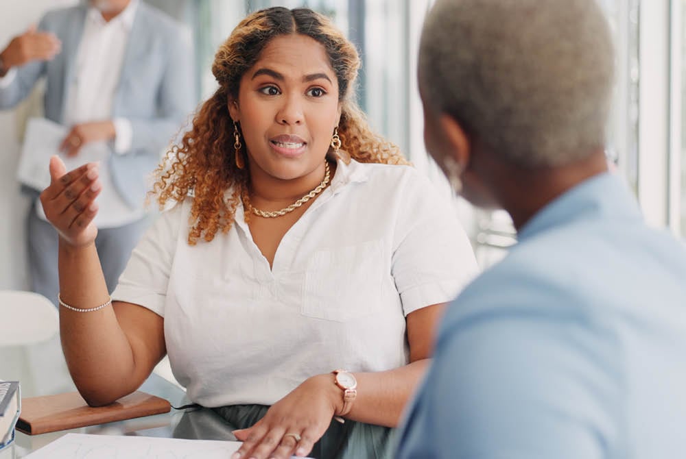 Two people have a conversation