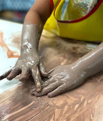 Child playing with clay