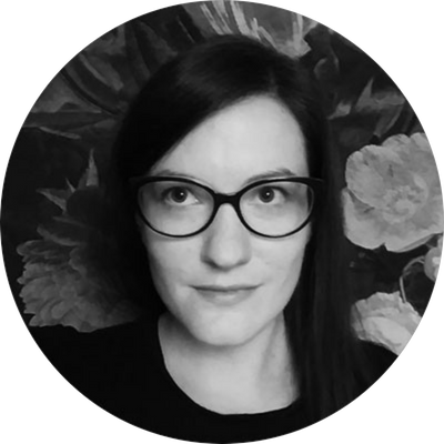 A black and white headshot of Monika.