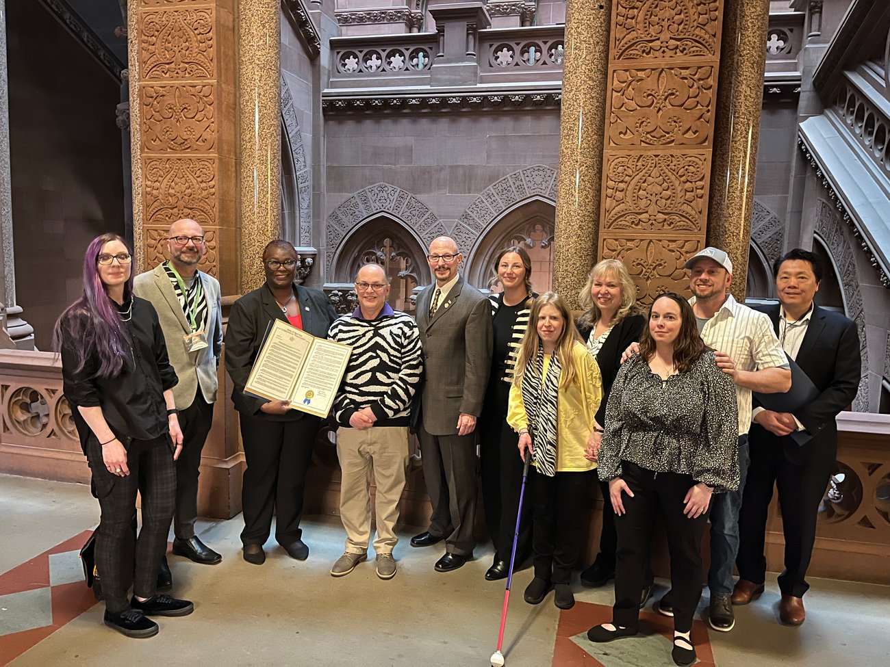 Rare disease advocates posing with New York State Senators Persaud and Murray as part of their lobby day to support the bill to create a NY Rare Disease Advisory Council (RDAC), sponsored by Sen. Persaud