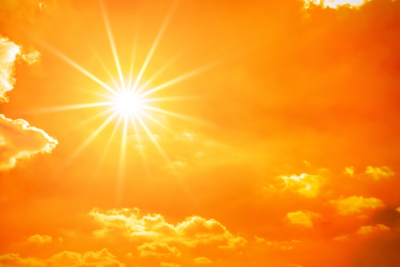  a picture of an orange sky featuring a very bright sun