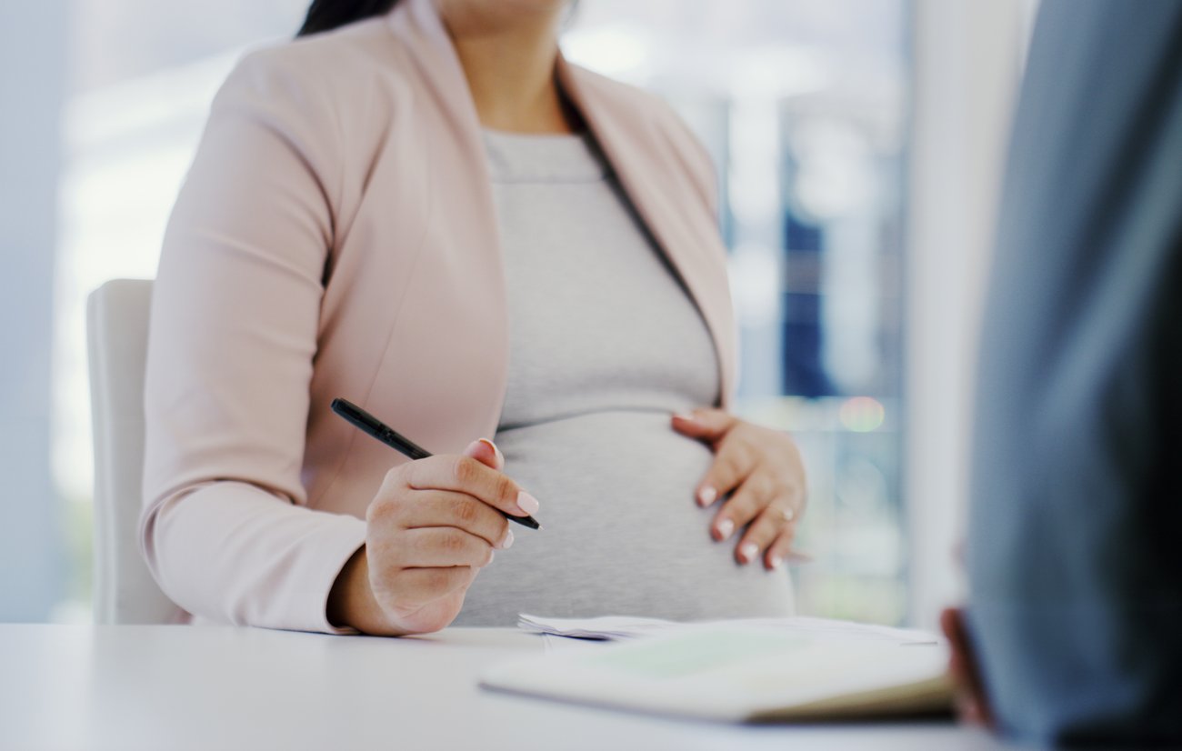 Pregnant Employee at desk