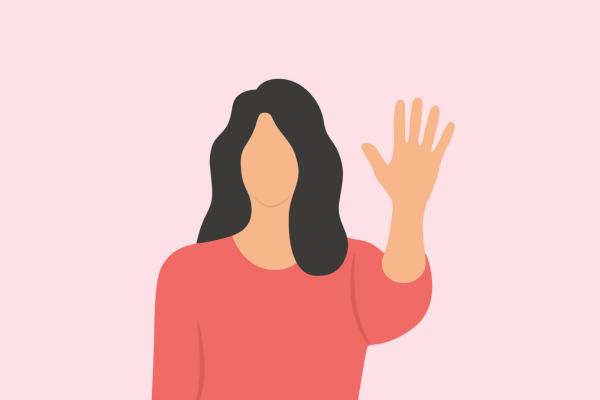 faceless woman holding up hand in a "stop" gesture